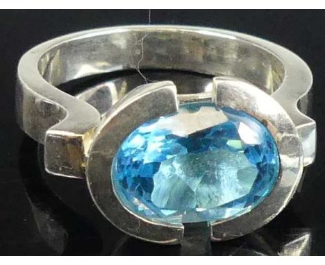 A contemporary silver and blue zircon set dress ring, sponsor YC, size S, 7.7g