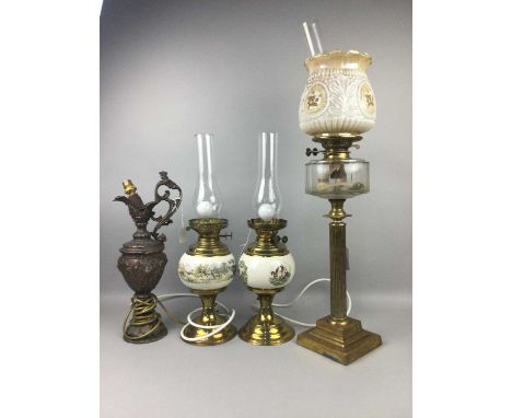 OIL LAMP,on cast metal column stand, along with a pair of cast metal ewers with lamp fittings and another pair of lamps (5)