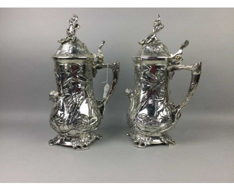 PAIR OF CONTINENTAL SILVER PLATED TANKARDS,relief decorated in the Art Nouveau manner, 41cm highCondition report: Some small 