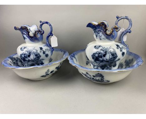 PAIR OF VICTORIAN BLUE AND WHITE CERAMIC EWERS AND WASH BASINS (4)Condition report: General surface wear to gilt and print ar