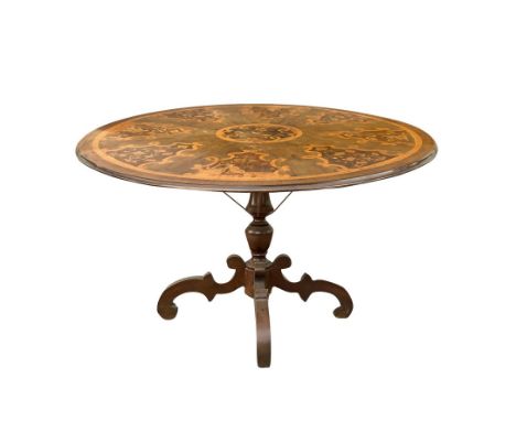 Round table with four-star base, in briar walnut and inlays in light woods, nineteenth century cm. 77 x 118  