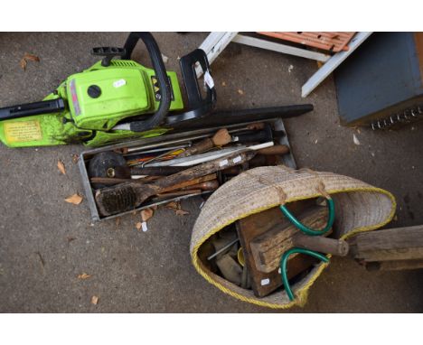 Chainsaw along with a group of hand tools&nbsp;
