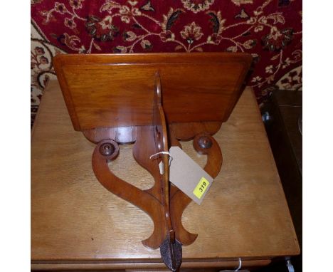 A 19th century mahogany wall bracket with pierced scrolling decoration, H.31cm 
