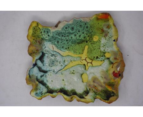 An Irish abstract ceramic plaque, signed, together with a studio pottery tile titled 'Back to the Wreck' 