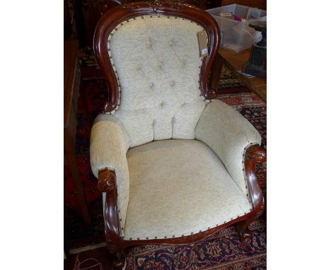 A pair of Victorian style mahogany spoon back armchairs, with cream button back upholstery, raised on cabriole legs
