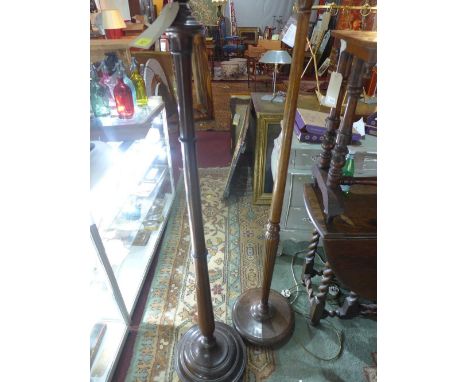 A mahogany standard lamp base, H.160cm, together with an oak standard lamp base, H.158cm 