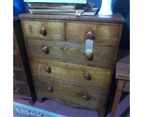 A 19th century elm chest with two short over three long drawers, raised on shaped bracket feet, H.109 W.86 D.48cm 