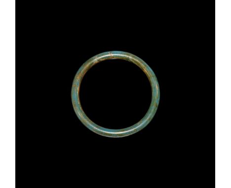 1st-2nd century AD. A round-section blue-green glass bangle with butt joint.   34 grams, 82mm (3 1/4"). Ex Crane collection, 