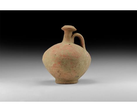 1st century AD. A terracotta flask with bulbous-shaped body, long neck with wide rim and looped handle.   320 grams, 13cm (5"