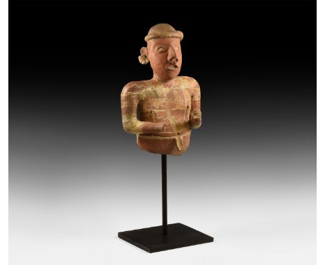 3rd century BC-5th century AD. The upper half of a male Nayarit culture ceramic statue, wearing cap with bands of net-pattern