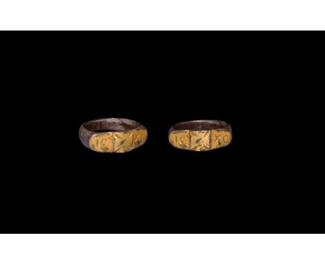 8th-11th century AD. A byzantine ring with D-shaped hoop and rectangular bezel comprising three square-shaped sections; centr