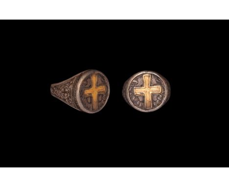 18th-19th century AD. A silver finger ring comprising a flat hoop, tapering shoulders with foliage panels and cross-in-rosett