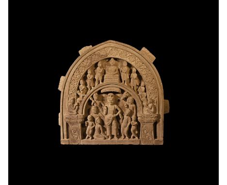 4th-6th century AD. A schist arched panel with scene to the centre of Buddha with urna, moustache and elongated ears, hair pu