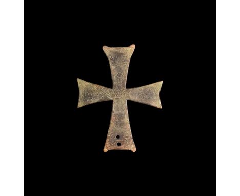 10th-11th century AD. A bronze cruciform expanding-arm plaque with two fixing holes, low-relief nimbate figure in orans postu