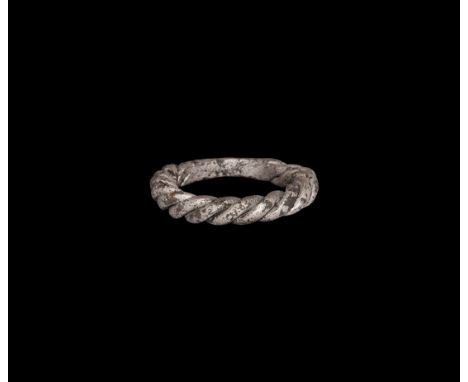9th-11th century AD. A silver finger ring formed from twisted rods tapering to the reverse. Cf. Sedova, M. V. Yuvelirniye izd