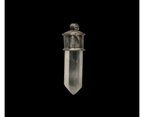 9th-12th century AD. A silver pendant with suspension hoop, sheet-silver cap and faceted rock crystal insert. Cf. Korshun, V.