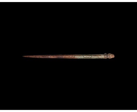 2nd-3rd century AD. A bronze stylus with finely tapered tip, round-sectioned ridged shank and round finial end.   20 grams, 1