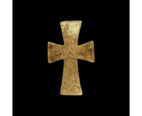 12th-14th century AD. A bronze expanding-arm cross appliqué with low-relief border, facing nimbate robed figure with guilloch