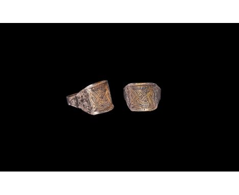 9th-11th century AD. A parcel-gilt silver finger ring comprising a flat-section hoop and flared shoulders, pointillé detailin