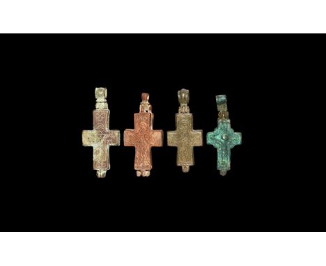 10th-12th century AD. A mixed group of bronze reliquary cross pendant each with low-relief imagery to both faces.   154 grams