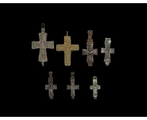 10th-14th century AD. A mixed group of bronze reliquary cross pendants, each with figural decoration to both faces.   153 gra