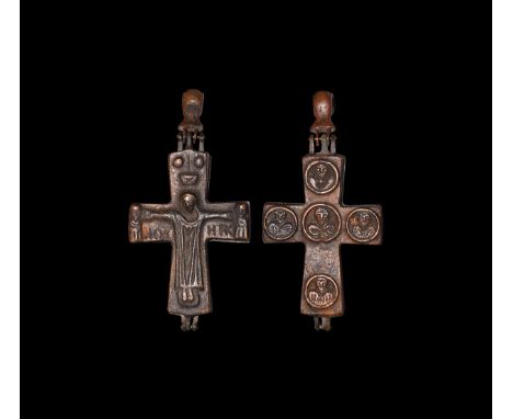 14th-15th century AD. A bronze reliquary cross pendant with low-relief image of Corpus Christi in shroud flanked by two busts