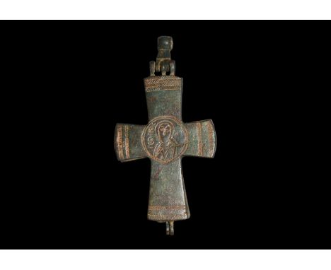 10th-12th century AD. A bronze reliquary cross pendant with full-length Mary Thetokos and infant Jesus between nimbate busts 