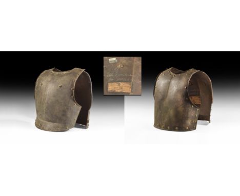 16th-17th century AD. A pair of beaten iron cuirass plates, the breastplate with pronounced vertical rib and two rivets to fr
