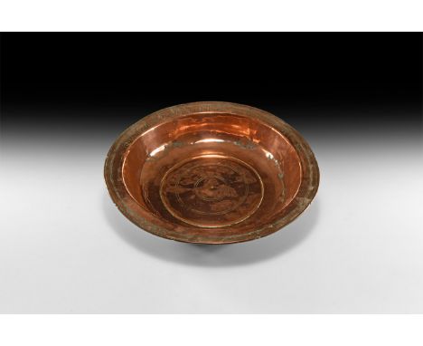18th century AD. A copper bowl with flared rim engraved with Armenian inscription; shallow body with concentric rings to the 