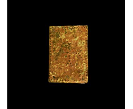 10th-13th century AD. A bronze rectangular plaque with punched dot cross fourchee and border, pierced at three corners for at