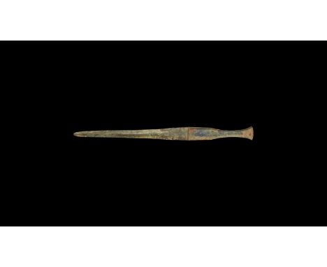 13th century BC. A bronze dagger with slender lentoid-section blade, hilt with socket to each face to accept an organic inser