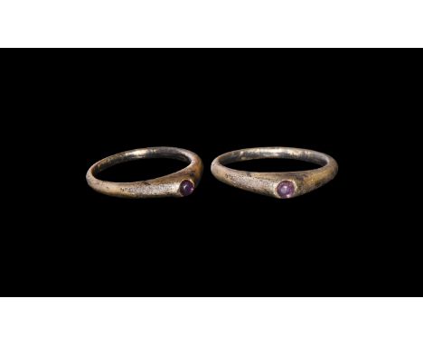 13th-14th century AD. A silver-gilt ring with tapering shank, bezel coming to a point and set with an amethyst.   3.90 grams,
