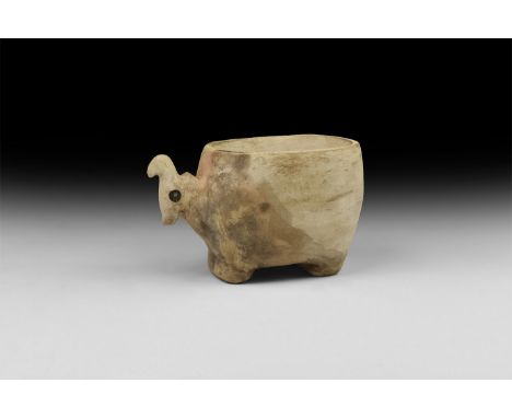 Naqada II Period, 3500-3200 BC. A calcite vessel in the shape of an animal, possibly a goat; large cylindrical body with flat
