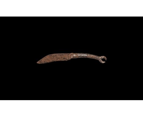 1st century BC-1st century AD. A single-edged iron knife with scooped forward edge to the blade, ribbed bolster, curved handl