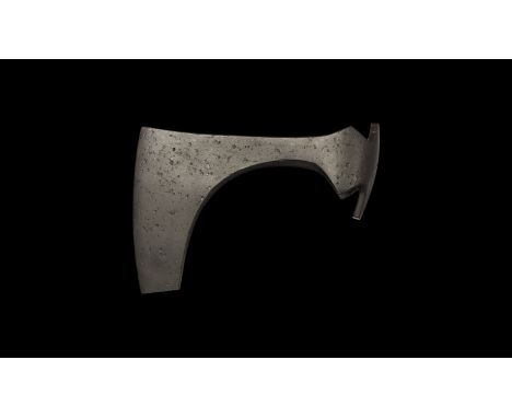 9th-11th century AD. A hand forged iron axehead with triangular-section blade, narrow neck widening to a broad bevelled edge 
