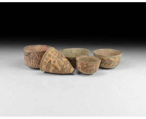 3rd millennium BC. A mixed group of ceramic vessel comprising: a plain bowl; a cup with frieze of fishes; a cup with frieze o