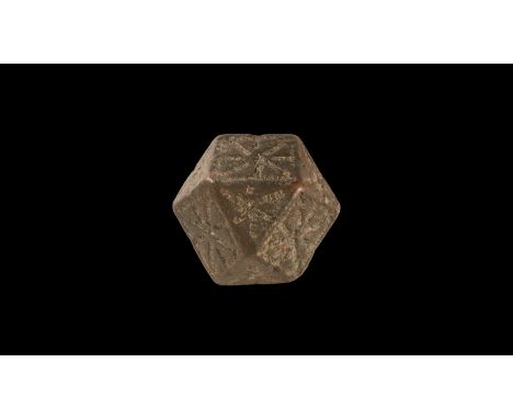 6th-8th century AD. A substantial bronze polyhedral weight with punched pellet geometric detailing to each face.   163 grams,
