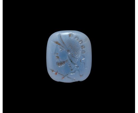 18th-19th century AD. A rectangular pale blue glass intaglio with engraved male bust wearing a helmet.   1.29 grams, 16mm (1/