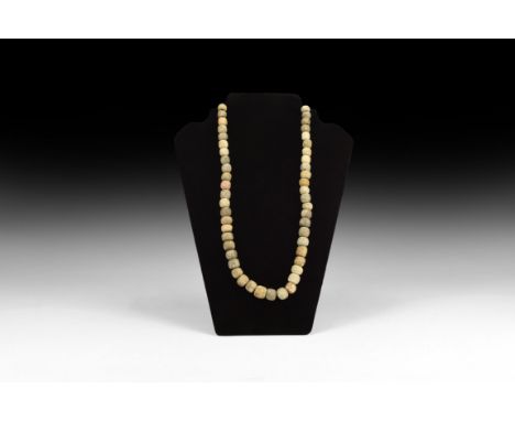 Devensian Period, 110,000-12,000 years BP. A group of oblate beads made from mammoth bone.   101 grams, 58cm (22 3/4"). Priva