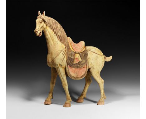 Tang Dynasty, 618-907 AD. A ceramic figure of a horse, head held up and mouth open, long mane falling to one side; red and br