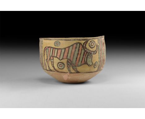 3rd millennium BC. A ceramic Nal culture bowl with polychrome decoration of a crouching lion, bull with disc between the horn