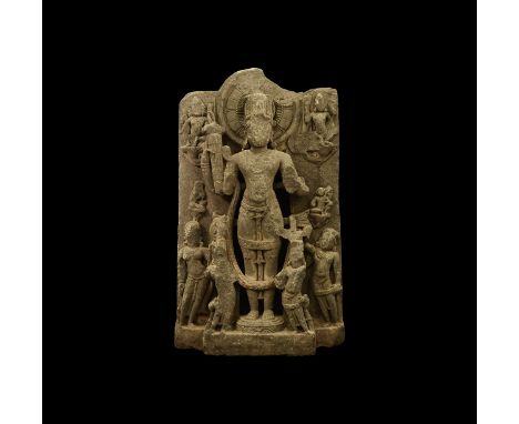 Pala Period, 10th-11th century AD. A schist panel depicting Vishnu, standing on a lotus flower base, wearing a jewelled conic