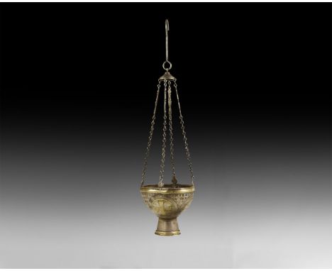 10th-12th century AD. A silver lamp with hemispherical body resting on a circular stand; raised gold band to the outer rim an