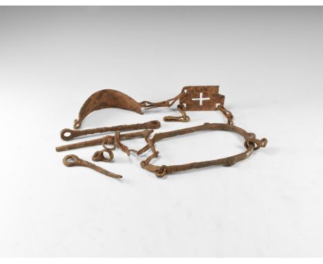 10th-13th century AD. A mixed iron group comprising: a prick spur with silver inlay, a stirrup with cruciform void to the pla