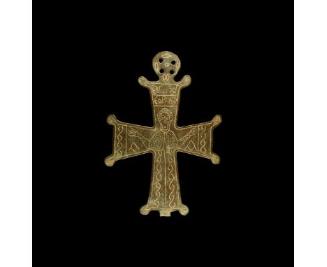 9th century AD. A bronze cruciform plaque with expanding arms and hatched lobe to each angle, pierced lobe above, low-relief 