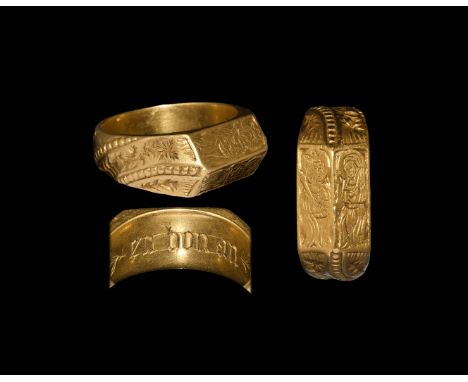 15th century AD. An exceptional gold finger ring comprising a D-section hoop and facetted plaque; the hoop with diagonal pell