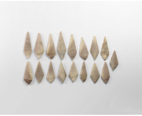 Neolithic, 3rd-2nd millennium BC. A group of seventeen pale grey bifacial trapezoidal, finely knapped points.   80 grams tota