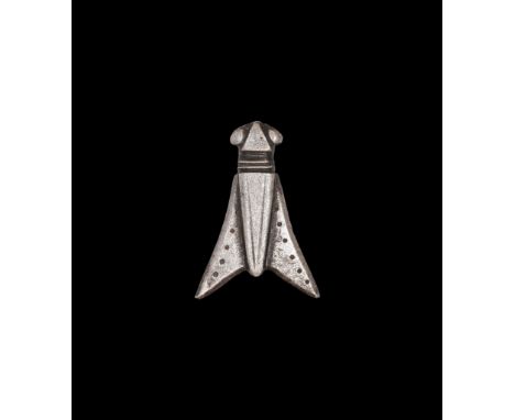 2nd century AD. A silver plate brooch of a cicada with punched-point detailing to the triangular wings, pin-lug and catch to 