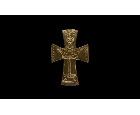 12th-14th century AD. A flat-section bronze expanding-arm cross mount with low-relief nimbate figure in orans posture, zigzag