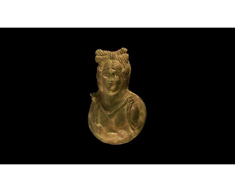 1st-2nd century AD. A bronze bust of a maenad, hair arranged into a bow at the top, falling to shoulders at sides; eyes inlai